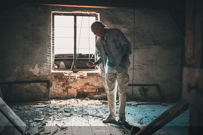 MAN AT WORK – at the attic of an abandoned guesthouse