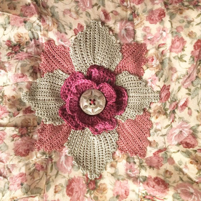 Crochet flower to cover an insert for a dress alteration.