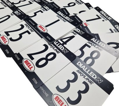 Custom printed reusable PVC MTB race boards in use during the Dialled In Downhill mountain bike race series.