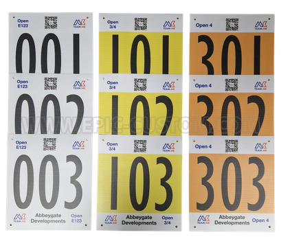 Custom printed CTT-compliant vinyl time trial numbers produced for Team MK cycling events, featuring rider numbering, category identification and event branding.