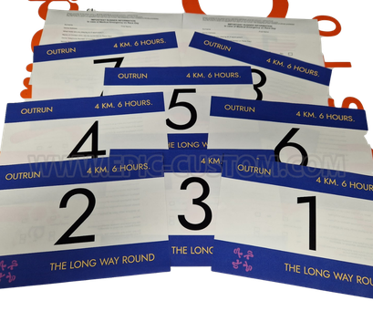 Custom printed Tyvek runner race bib numbers produced for the OUTRUN endurance running event.