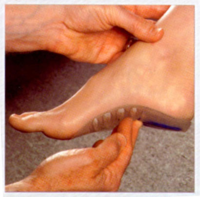 demonstrating how a custom orthotic fills the arch of the foot