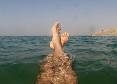 Floating in the dead sea, Jordan. Dante Harker