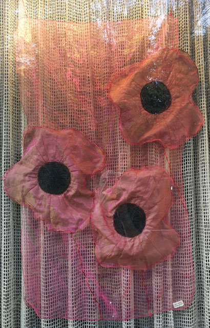 Photo of appliqué hanging of poppies