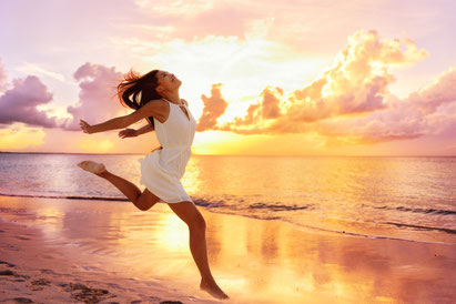 A very happy and satisfied client jumping for joy after Nutrition and Lifestyle Coaching