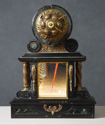 Assemblage light art sculpture which incorporates two visual focal points. At the top is a clock with an Art Nouveau face. At the bottom is an infinity mirror with glass beads and LEDs. The structure which holds the two together was a marble clock.