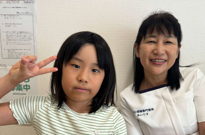 患者さまと院長の笑顔の写真
