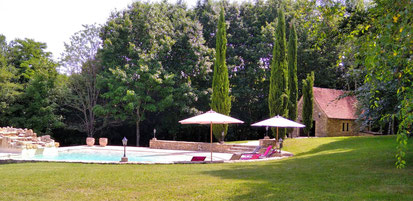 The pool, slightly away, separated by a wooded area