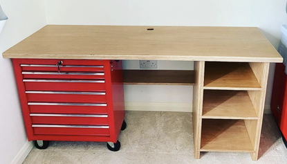 picture of the desk with just the metal tool box and basic worktop and shelves