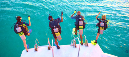 Photo of divers entering water during a PADI specialty course Boat diver at Nusa Penida