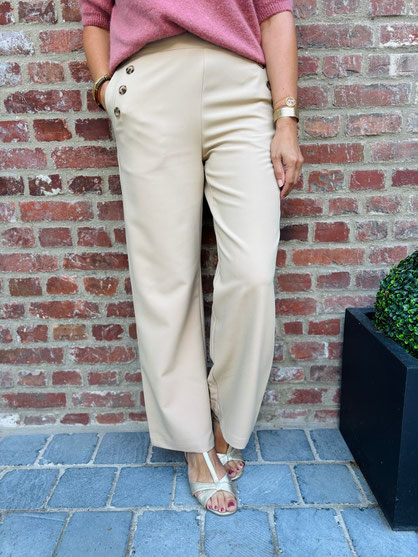 VETEMENT FEMME PANTALON À PONTS BEIGE IN APRIL 1986