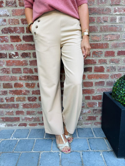 VETEMENT FEMME PANTALON À PONTS BEIGE IN APRIL 1986