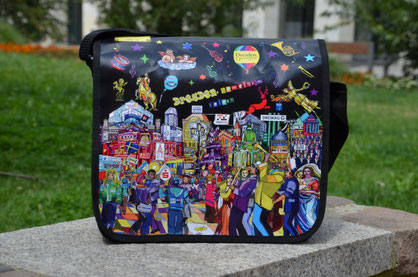 hier sieht man das Student Welcome Package 2016 auf einer Mauer in einem Dresdner Park