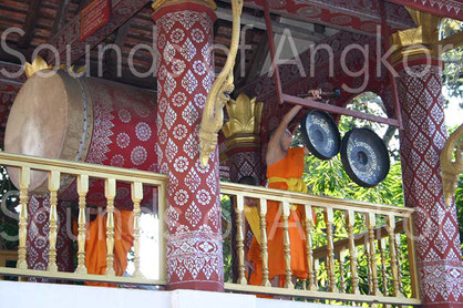 Drum set and pair of bossed gongs in the communication tower of a Buddhist monastery. Luang Prabang, Laos.