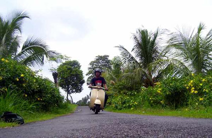 vespa on a small backroad