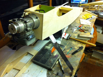 Test fit the engine; you can just see the back end of the Moth in the background.
