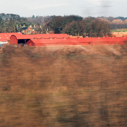 Farm toun with characteristic oxide-red roofs