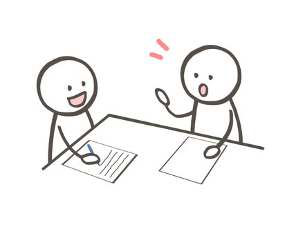 机を挟んで笑顔で対話する二人の棒人間のイラスト。入塾面談や個別カウンセリングでアドバイスを行っている様子。