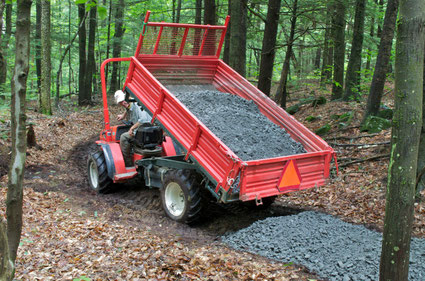 Michael and 'Goldie' installing the base layer for the accessible loop trail. 