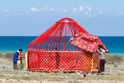 Setting down the yurt in front of Issyk Kul Lake, Kyrgyzstan