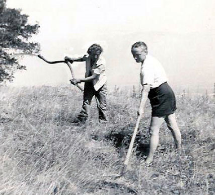 AGNES BARON (left), Meher Mount co-founder and lifetime caretaker, and Margaret Craske, a disciple of Meher Baba and ballet teacher from New York City, tackle the weeds during a month of silence in July 1949