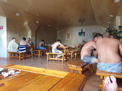 Banya in Bishkek, men wearing a towel in restaurant section