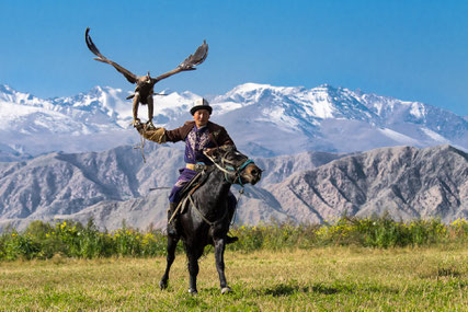 Scenic view of Eagle Hunter Ruslan and his eagle in Bokonbaevo, Kyrgyzstan
