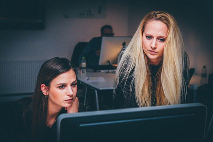 Two female office workers.