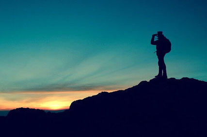 Man on mountain top.