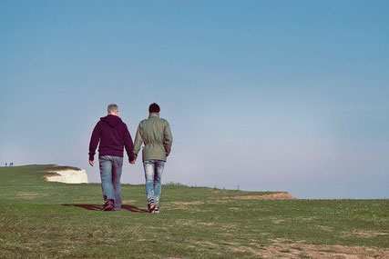 Men holding hands.