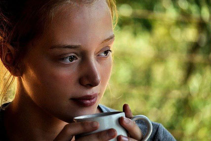 Thoughtful woman drinking tea.