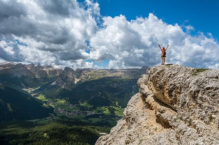 Happy woman on mountain.