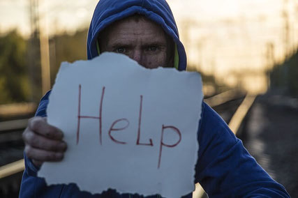 Homeless man asking for help.