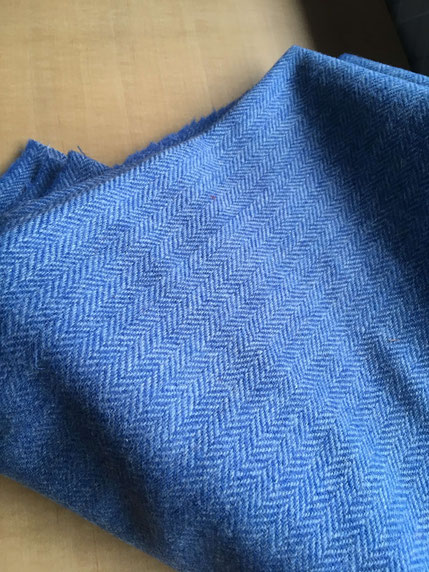 Bright blue Harris Tweed bearing a herringbone pattern