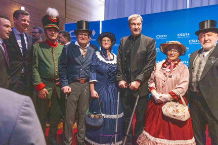 Bild mit Markus Söder, links Maximilian Stöckel und Landrat Dr. Oliver Bär