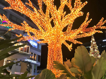 Text: Christmas Tree with Orange Lights (1st), Eastwood City, Philippines