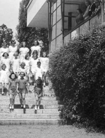 Tugendhat House, garden steps with students from the Hladka Dance School, circa 1950; the window (with muntins) is still retractable.