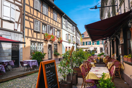 Cafes in Petite-France in Strasbourg. Petite-France is an historic area in the center of Strasbourg, France Copyright Sergey Kelin