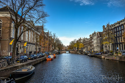 Amsterdam canal, blue skies, afternoon stroll