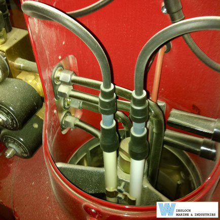 Weishaupt burner nozzle assembly, showing a nozzle head with two ignition electrodes.