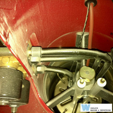 Weishaupt burner showing a nozzle head with ignition electrodes, two Parker solenoid valves, oil hose adapter and flame tube.