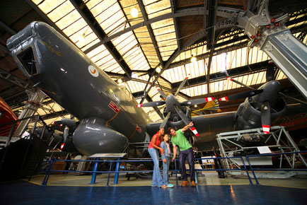 Family looking at aircraft inside the Air & Space Hall at the Museum of Science and Industry in Manchester, Manchester