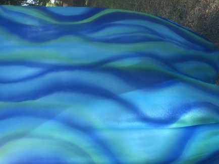 Silk flags painted to look like flowing water