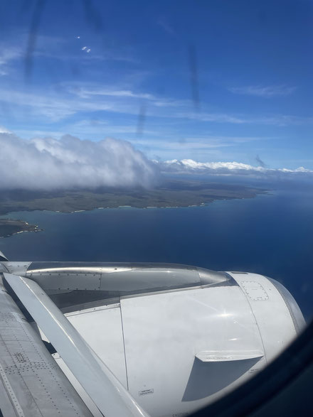 A photo out of the airplane window of landing in the Galapagos Islands