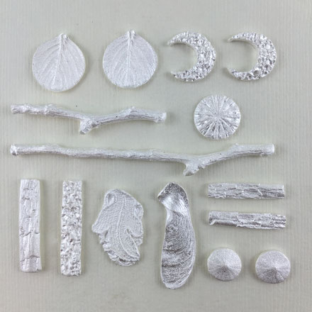 Silver metal clay pieces right after firing