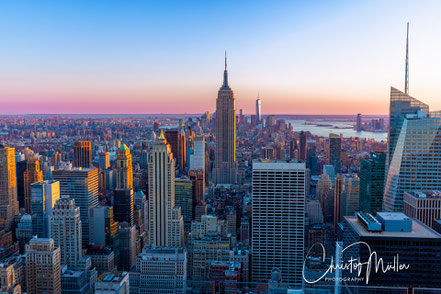 Aerial view from the Rockefeller Center with the Empire State Building during twilight
