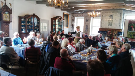 Thommi Baake performing live at the Ostfriesisches Teemuseum in Norden, sold-out show, audience listening attentively