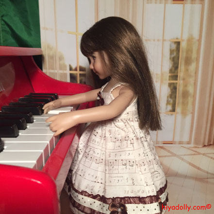 Dianna Effner Little Darling Doll, handpainted by Dianna Effner,is practising piano for a special event