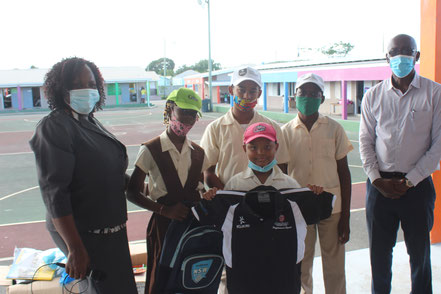 Villa Primary School Principal, Sandra Felix with happy students receiving Cricket Kindness kit on Jan 12, 2021. 