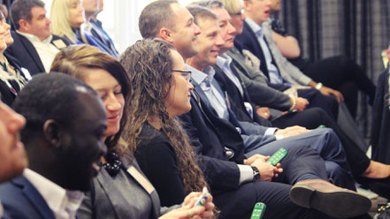 Audience Reponse system handset being used by young lady at conference